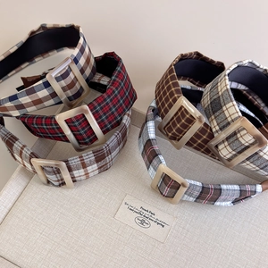 Detail of vintage plaid headbands with acrylic buckles in various fall colors