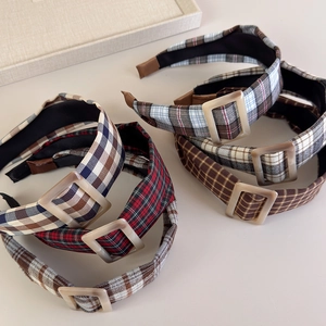 Detailed close-up of vintage plaid headbands with fabric wrap and square resin buckle