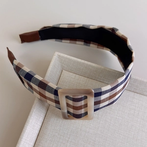 Detailed view of vintage brown plaid wide headband featuring a frosted square resin buckle