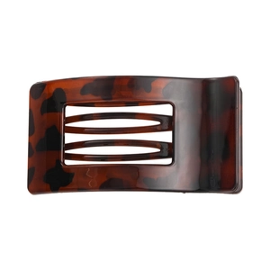 Macro detail of tortoiseshell pattern on flat rectangular resin hair claw clip for women