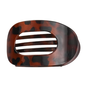 Detail view of the tortoiseshell pattern and smooth resin finish of the flat hair claw clip