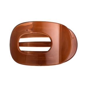 Elegant amber acetate hair claw clip with large oval cutout and translucent finish