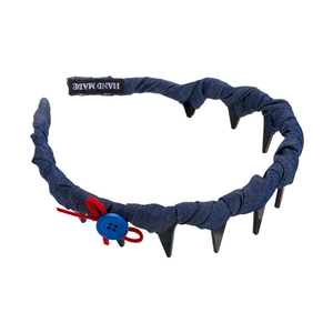 Retro British style padded headband with denim fabric, punk spikes and red bow detail