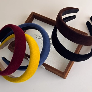 Retro velvet padded headbands in assorted vintage colors shown from a top-down view