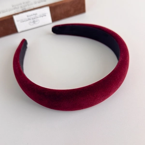 Macro detail of wine red velvet headband showing thick padded texture and non-slip inner lining