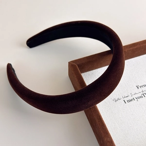 Macro view of dark brown velvet headband showing premium texture and anti-slip lining
