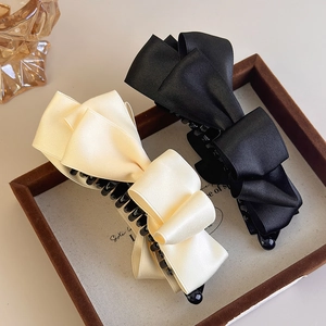 Elegant satin bow banana clips in black and beige for high ponytail hairstyling