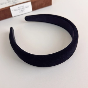 Detail view of black velvet padded headband with premium texture for high crown look