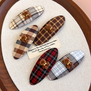 Five-piece set of cute plaid hair clips featuring brown flocked bears on a wooden tray