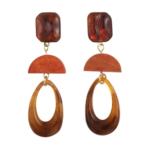 Retro geometric amber resin drop earrings with wood detail on white background