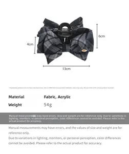 Detailed size view of the 13cm dark grey plaid bow hair claw clip with golden accent