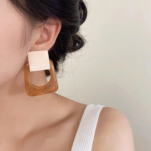 French style vintage geometric square resin earrings worn by a model in soft light