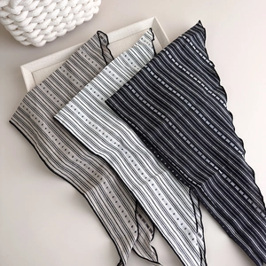 Close-up of retro striped fabric neckerchiefs with jacquard texture and fine hemming