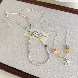 Colorful crystal star necklace with silver-tone beads and vibrant dopamine style pendants