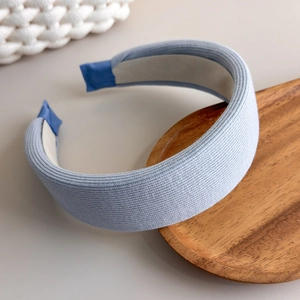 Detailed macro view of light blue knitted headband showing ribbed texture and nonslip lining