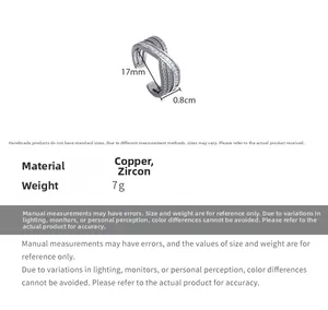 Detailed view of silver cross ear cuff with white zircons and technical dimensions