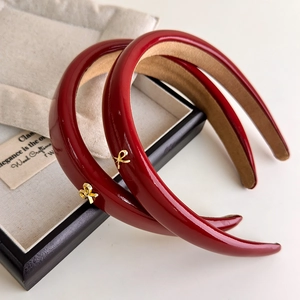 Retro red PU leather headband with golden bow detail and anti-slip lining