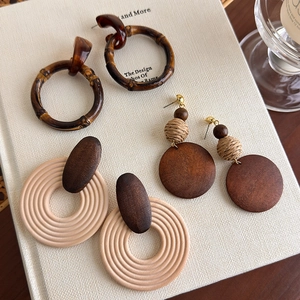 Bohemian style wooden earrings collection with bamboo and woven circular geometric designs