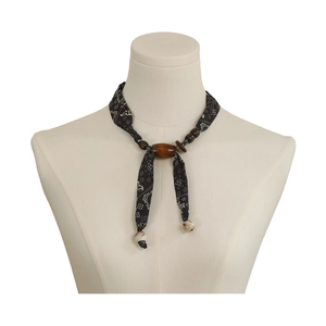 Bohemian paisley bandana necklace with wooden beads and shell accents on mannequin