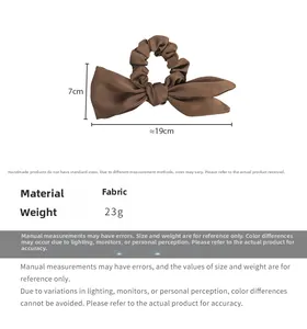 Detail showing dimensions of 19cm by 7cm for a dark brown satin bow scrunchie