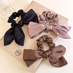 Chic satin bow scrunchies set in black, dusty pink, and coffee silk texture