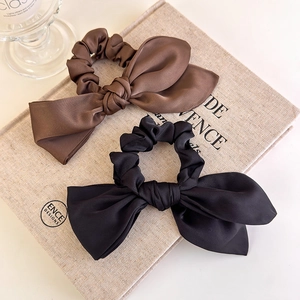 Elegant satin bow scrunchie set in brown and black with premium glossy silk texture