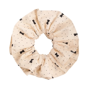 Chouchou beige à pois avec motifs nœuds pour queue de cheval et chignons