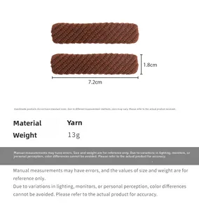 Detail view of brown knitted hair clips showing 7.2cm length and 1.8cm width size dimensions