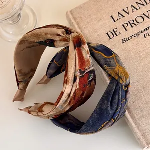 Retro tie-dye twist headband for women featuring abstract oil painting patterns in vintage tones