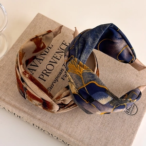 Vintage tie-dye fabric knot headbands in floral and abstract patterns for women