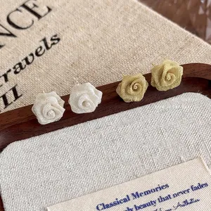 Elegant 3D copper wire mesh rose stud earrings in champagne gold and cream white tones