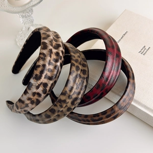 Set of four padded animal print headbands in vintage leopard and faux leather textures