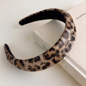 Close-up of leopard print headband with thick foam padding and non-slip lining