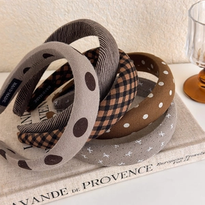 Retro padded fabric headbands featuring brown check and polka dot patterns for women