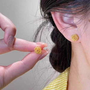 Elegant gold mesh rose stud earrings with textured petals for a luxurious fashion look