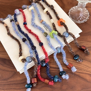 Handmade vintage knitted beaded necklace with multicolored yarn and unique resin beads