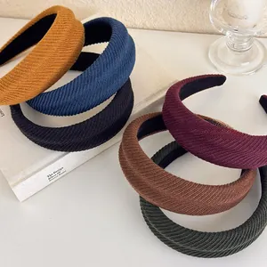Detail shot of multi-color thick knit headbands with textured patterns and retro design