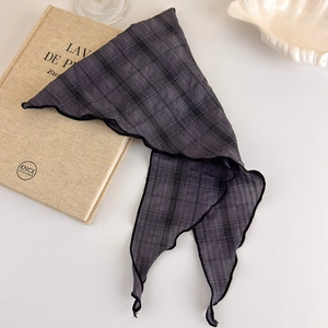 Detail of grey plaid cotton linen bandana featuring delicate black wavy stitched edges