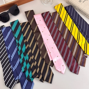 Stylish preppy striped neckties featuring classic patterns and bee embroidery for formal shirts
