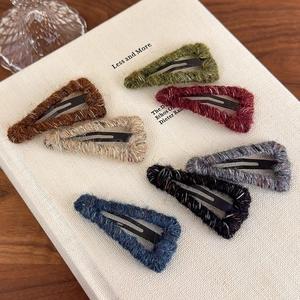 Set of 7 colorful wool-wrapped triangle hair clips in various autumn and winter shades
