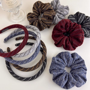 Knitted striped headband and scrunchie set in assorted autumn colors with handmade label