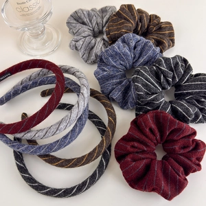 Chic striped knit headband and scrunchie set in elegant autumn tones for hair styling