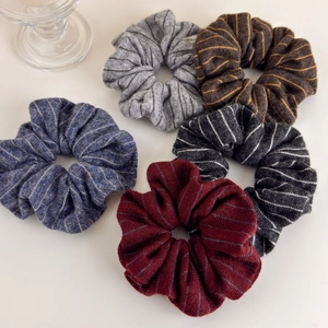 Detailed set of five striped knit hair scrunchies in various autumn winter colors
