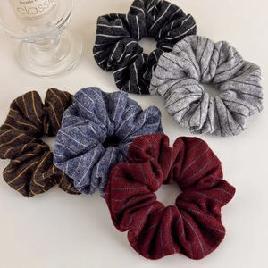 Set of five knitted striped scrunchies in black, grey, coffee, blue and dark red colors