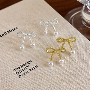 Elegant gold and silver bow pearl stud earrings set with unique woven texture design