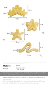Detail view of yellow starfish and flower hair claws with sizes and weights labeled