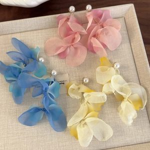 Elegant floral pearl earrings with layered fabric petals and tassels in three colors