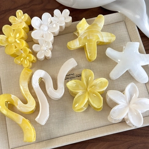 Elegant yellow and white flower and starfish claw clip set with marble texture finish