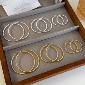 Sparkling frosted hoop earrings set in gold and silver colors with three sizes