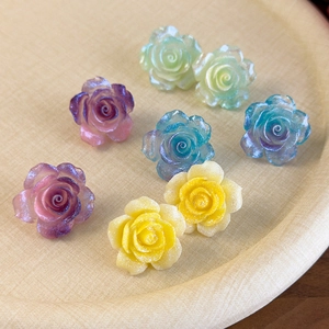 Boucles d'oreilles camélia en résine avec paillettes en dégradé de couleurs pastel